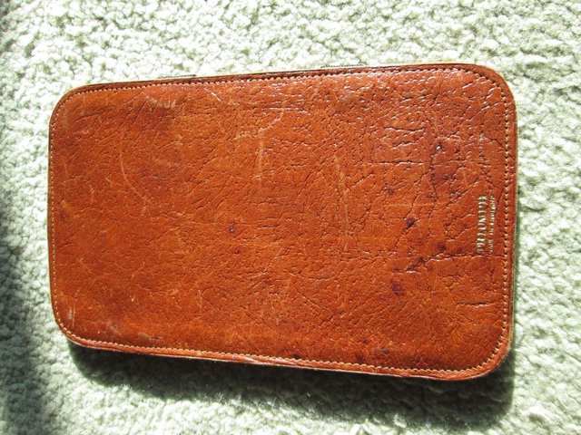 Preview of the first image of Triumph leather magic wallet (Incl P&P).