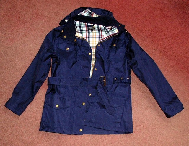 Preview of the first image of Lady's quality rainwear coat, Size 14 - New.