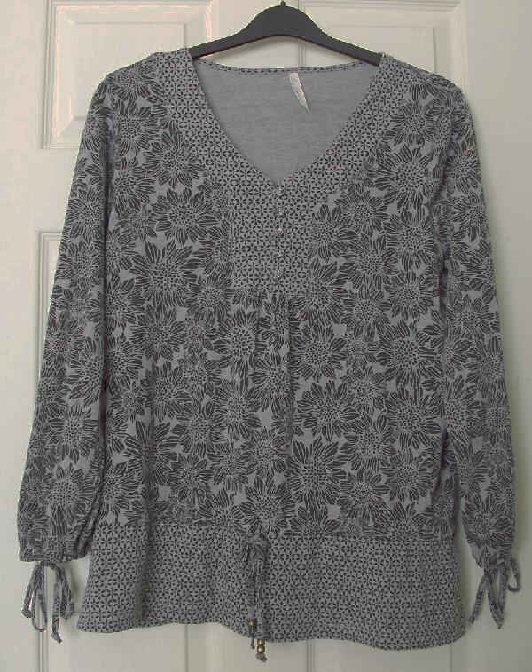 Preview of the first image of Ladies Black/Grey Flowered Top With Tie Detail - sz 14  B18.