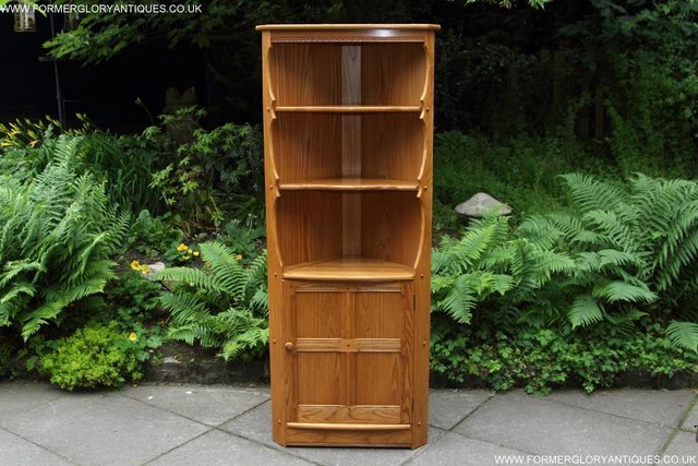 Preview of the first image of ERCOL LIGHT ELM CORNER DISPLAY CABINET CUPBOARD BOOK SHELVES.
