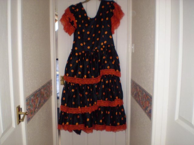 Preview of the first image of SPANISH DRESSBLACK/ORANGE WITH SPOTS.
