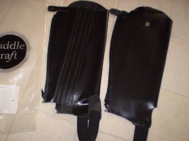 Preview of the first image of SADDLECRAFT BLACK LEATHER GAITERS- NEW.