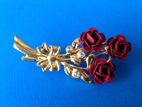 Preview of the first image of New Red flower gold plated brooch with clear stones.