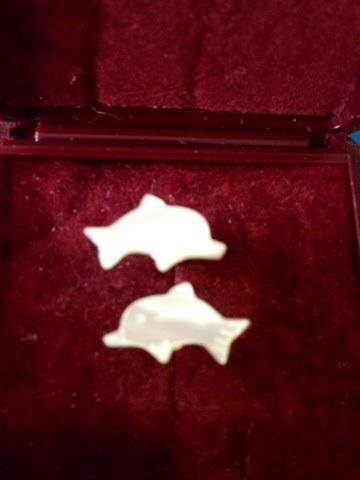 Preview of the first image of White pearl effect dolphin earrings.