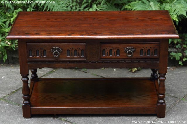 Preview of the first image of AN OLD CHARM JAYCEE TUDOR OAK COFFEE TEA TABLE STAND DRAWERS.
