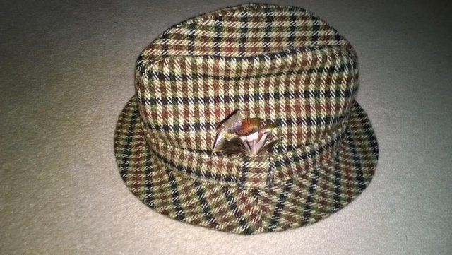 Preview of the first image of Country tweed trilby with feather detail.