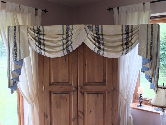 Preview of the first image of 2 sets lined curtains with swag and tail pelmets + 1.