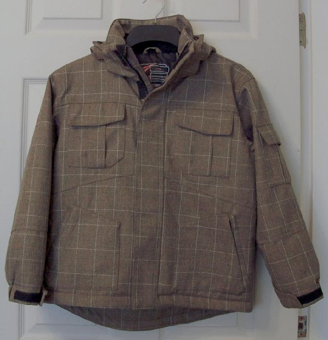 Preview of the first image of Childs Tweed Style Ski Jacket By Surfanic - Sz 140.