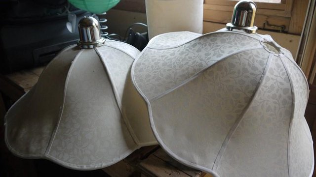 Preview of the first image of 2 large downhanging cream cloth lampshades.