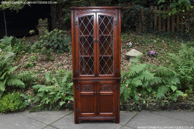 Preview of the first image of OLD CHARM TUDOR OAK CORNER DISPLAY CHINA CABINET SHELVES.