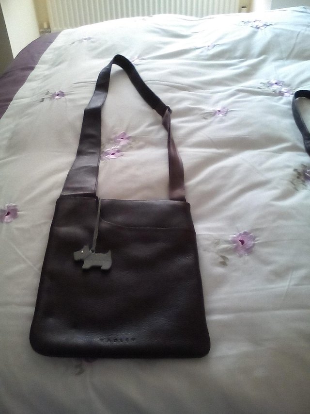 Preview of the first image of Dark brown hand bag.
