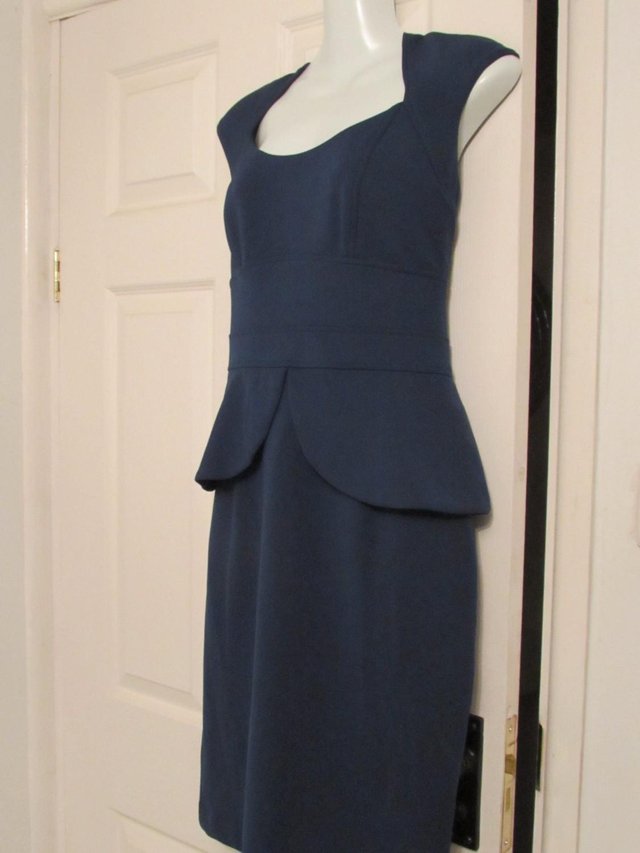 Preview of the first image of Teal dress size UK 12.