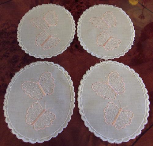 Preview of the first image of Pretty Set Of 4 Butterfly Embroidered Doilies.