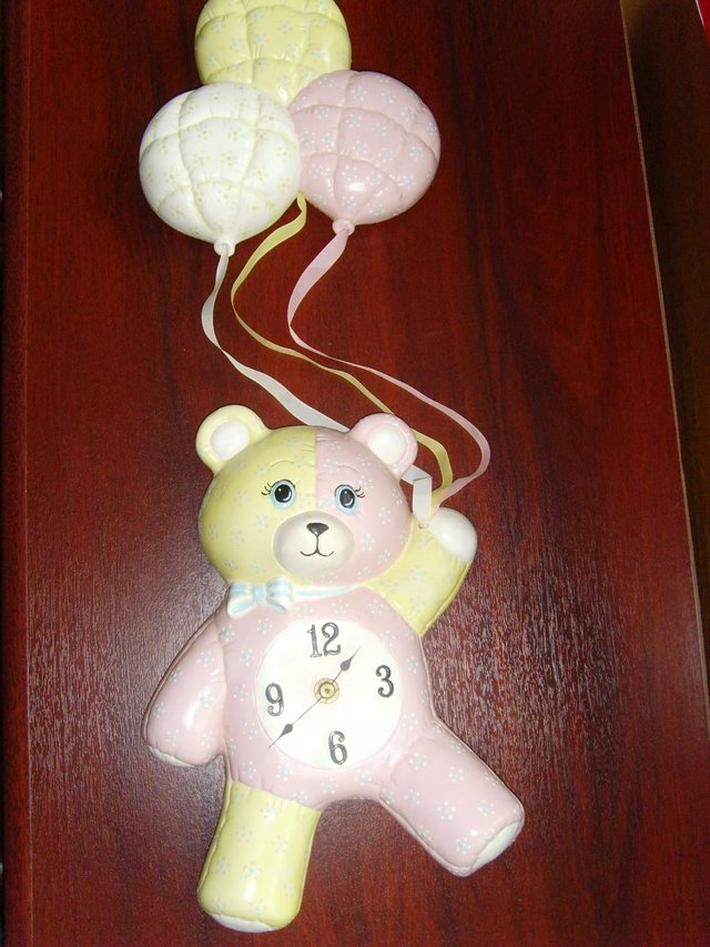 Preview of the first image of Child's ceramic hanging wall clock.