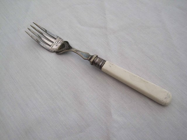 Preview of the first image of 1 engraved silver fork.