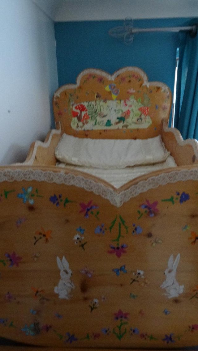 Image 4 of Handcrafted Pine Crib with Victorian craft decoration.