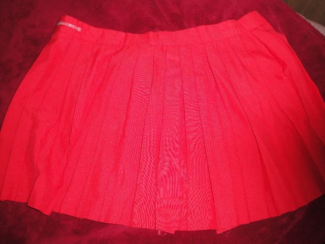 Preview of the first image of Red Gym Sports Skirt. Size 26. Has had little school use..
