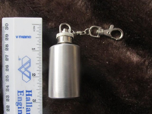 Preview of the first image of MINIATURE KEYRING HIP FLASK UNUSED NO PACKAGING.