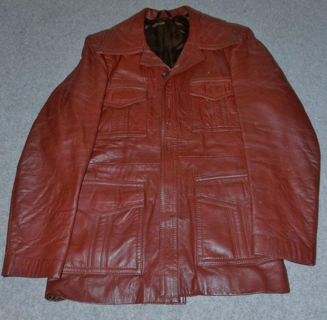 Preview of the first image of Leather SAFARI style leather coat in rich deep tan.