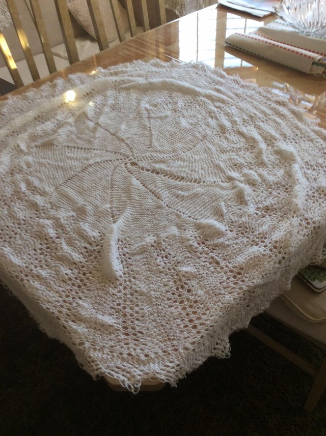 Preview of the first image of Circular hand made white baby shawl.