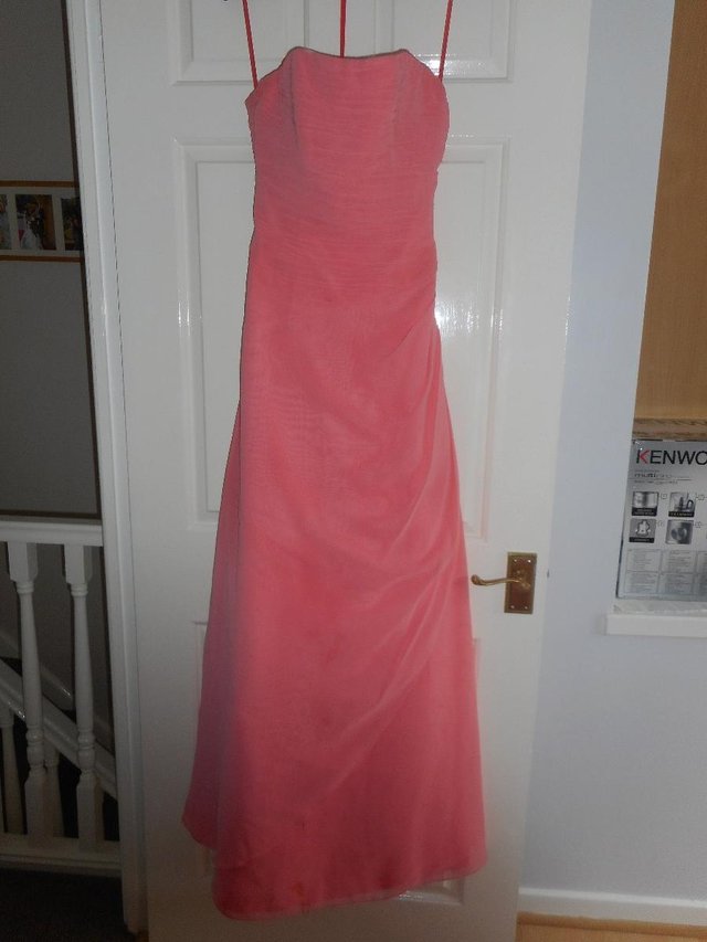 Preview of the first image of Raylia design, Size 8, strapless peach chiffon full length d.