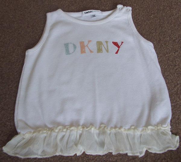 Preview of the first image of BEAUTIFUL BABY GIRLS DKNY SLEEVELESS TOP - AGE 3M.