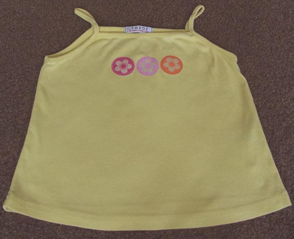 Preview of the first image of BEAUTIFUL GIRLS YELLOW VEST TOP AGE 7/8 YRS.