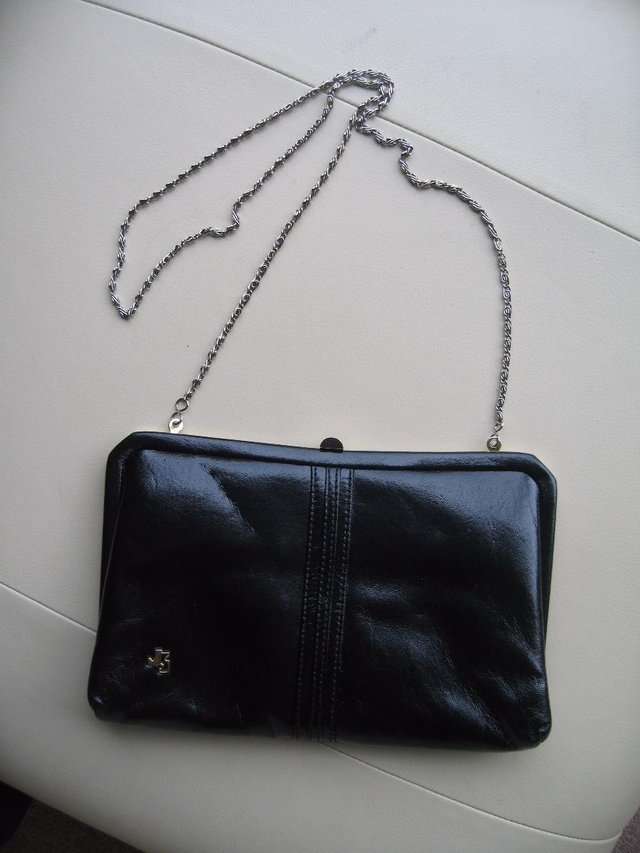 Preview of the first image of 'JAPELLE' Jane Shilton Smart Black Faux Leather Vintage Clut.