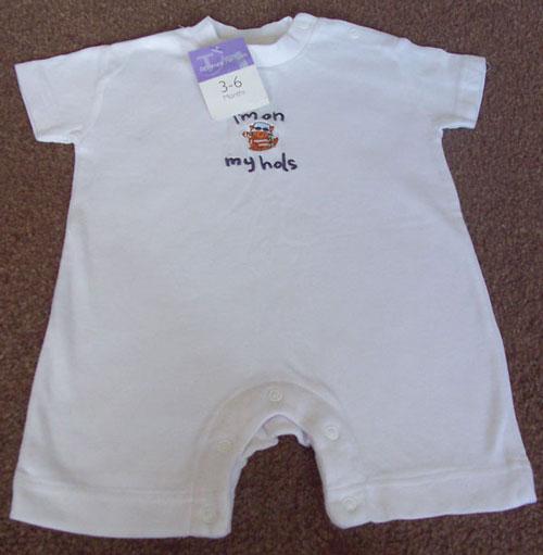 Preview of the first image of BNWT BABIES " I'M ON MY HOLS " WHITE BABYGRO - AGE 3/6M.