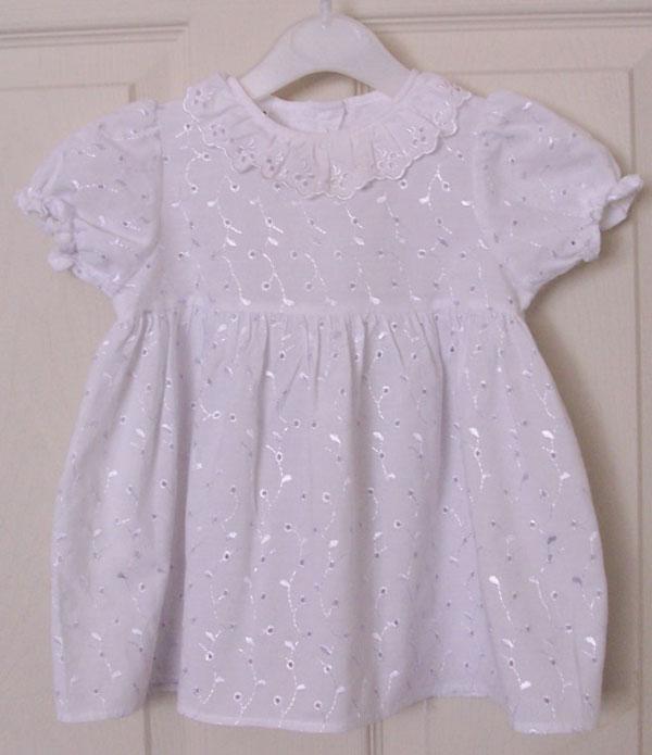 Preview of the first image of PRETTY BABY GIRLS WHITE BROIDERIE ANGLAIS DRESS - AGE 6/12 M.