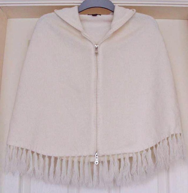 Preview of the first image of BEAUTIFUL LADIES CREAM HOODED CAPE BY NEXT - ONE SIZE.