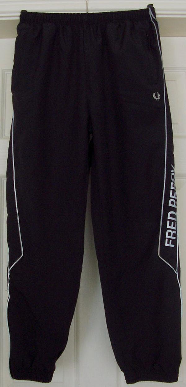 Preview of the first image of SMART BOYS BLACK TRACKSUIT BOTTOMS BY FRED PERRY - SZ XL.