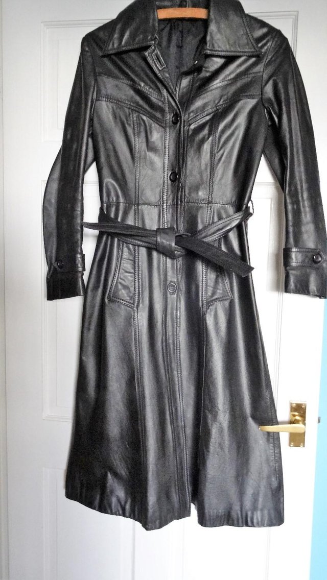 Preview of the first image of Ladies retro long black leather coat..
