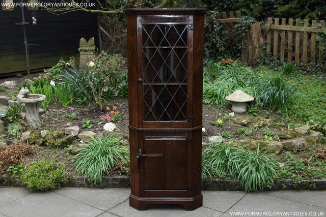 Preview of the first image of A NIGEL RUPERT GRIFFITHS OAK CORNER DISPLAY CABINET CUPBOARD.