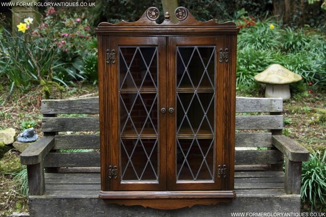 Preview of the first image of AN OLD CHARM LIGHT OAK CORNER DISPLAY CHINA CABINET CUPBOARD.