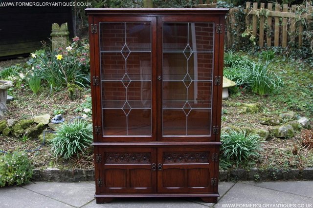 Preview of the first image of OLD CHARM TUDOR OAK DISPLAY CHINA CABINET SHELVES CUPBOARD.