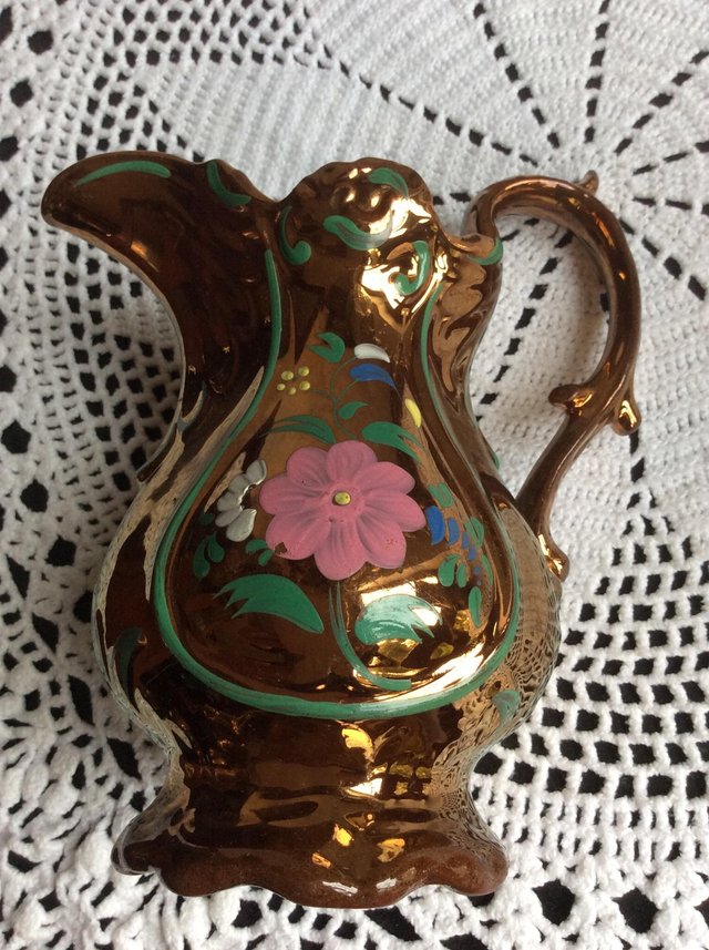 Preview of the first image of Antique copper lustre jug.