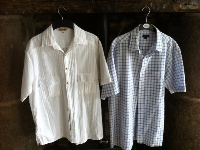 Preview of the first image of 2 mens designer short sleeved shirts (only 1 left).
