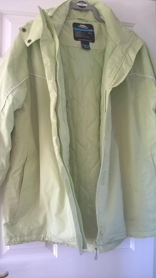 Preview of the first image of Ladies size 20 Green Regatta raincoat.