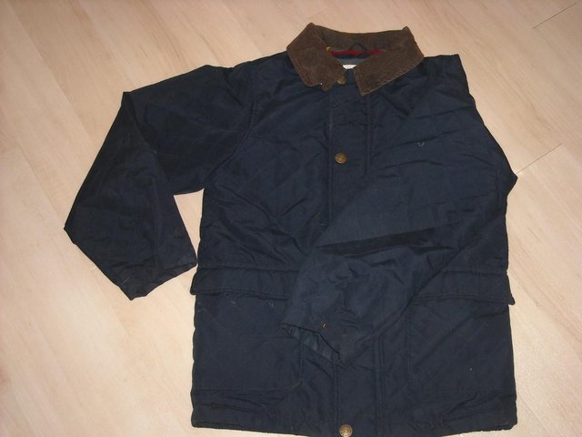 Preview of the first image of Osh Kosh Navy quilted coat Age 10.