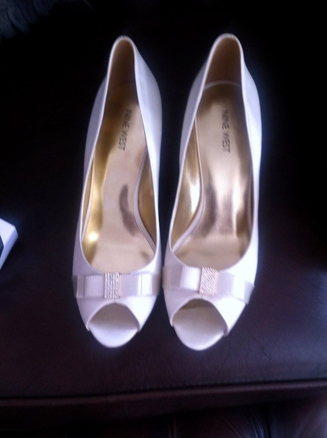 Preview of the first image of Brand new Wedding shoes and accessories.