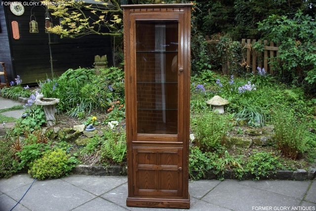 Preview of the first image of AN ERCOL GOLDEN DAWN CORNER DISPLAY CABINET CUPBOARD STAND.