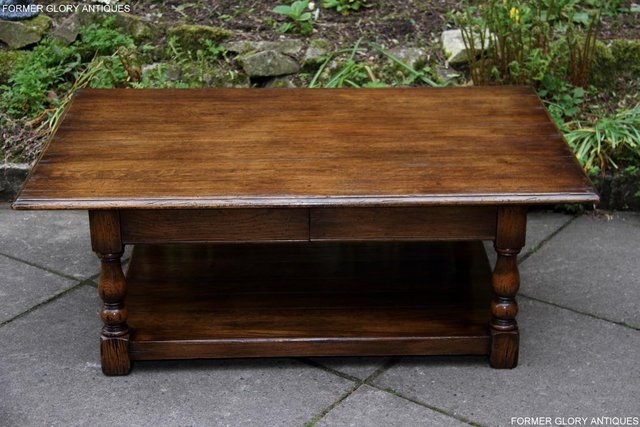 Preview of the first image of A TITCHMARSH GOODWIN STYLE OAK TWO DRAWER COFFEE TABLE STAND.