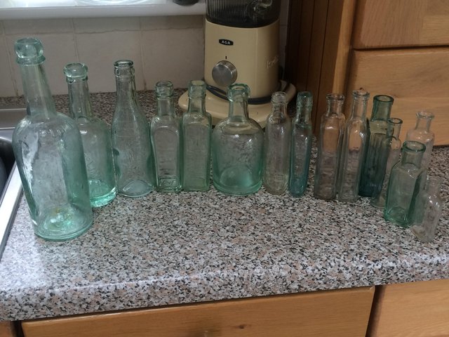 Preview of the first image of Old medicine bottles assorted shapes.