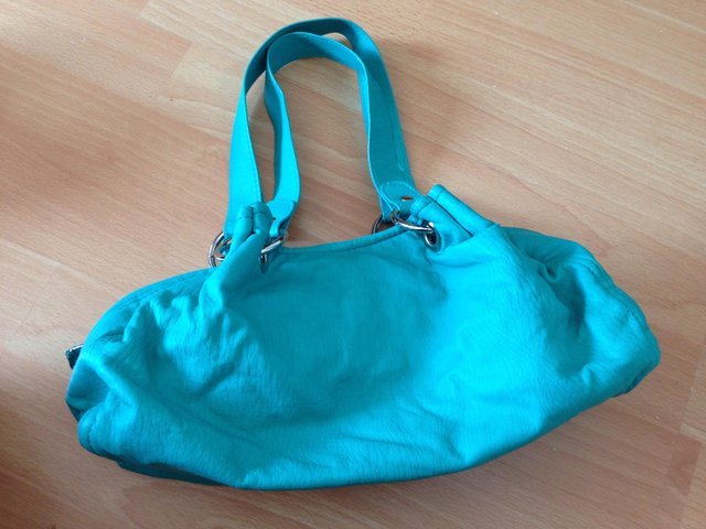 Preview of the first image of Turquoise Bag, in good condition.