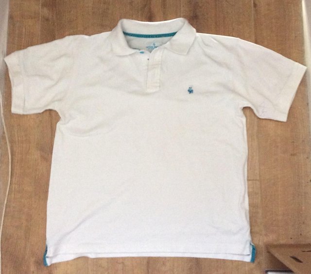Preview of the first image of Boys Le Coq Sportif White Polo Shirt Size XLB.