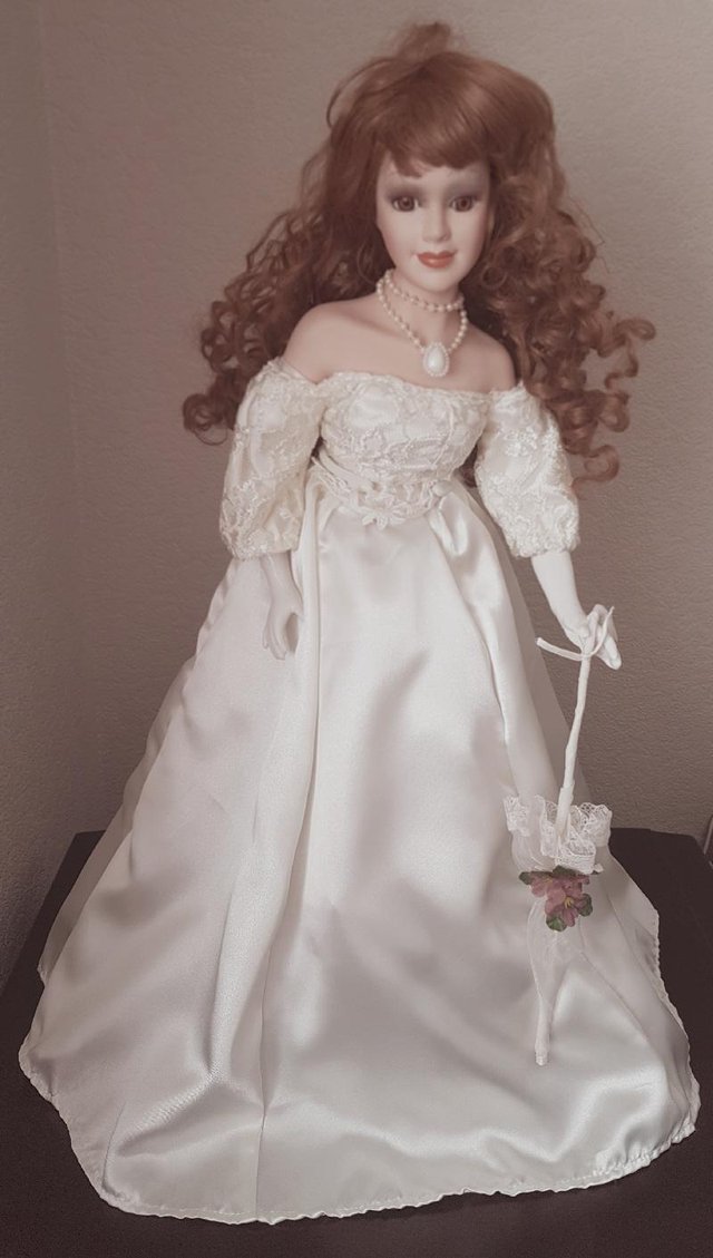 Preview of the first image of Exquisite Porcelain Lady With Ivory Gown & Sun Parasol.