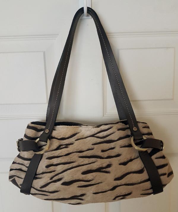 Preview of the first image of Beautiful Ladies Designer Cowhide Handbag By Coty Of Madrid.