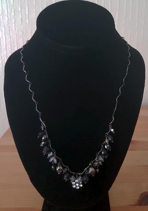 Preview of the first image of pretty black beaded necklace with diamante decoration.