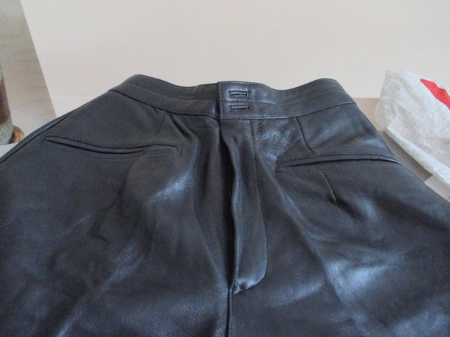Preview of the first image of BLACK LEATHER TROUSERS.